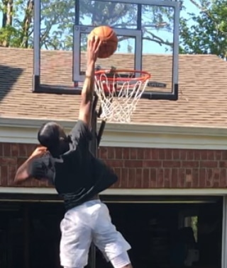 Basketball Recruiting- Outdoor Training session dunking off vertical. 