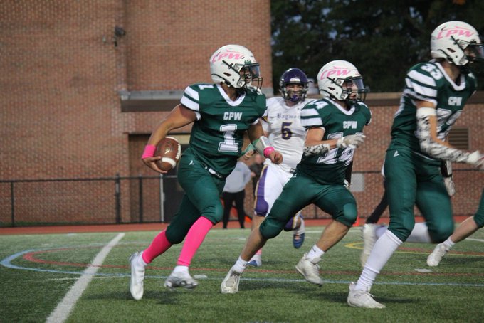 QB Jordan Gazit in the middle of football recruiting takes off to the right in Long Island football game for Carle Place Wheatley. 